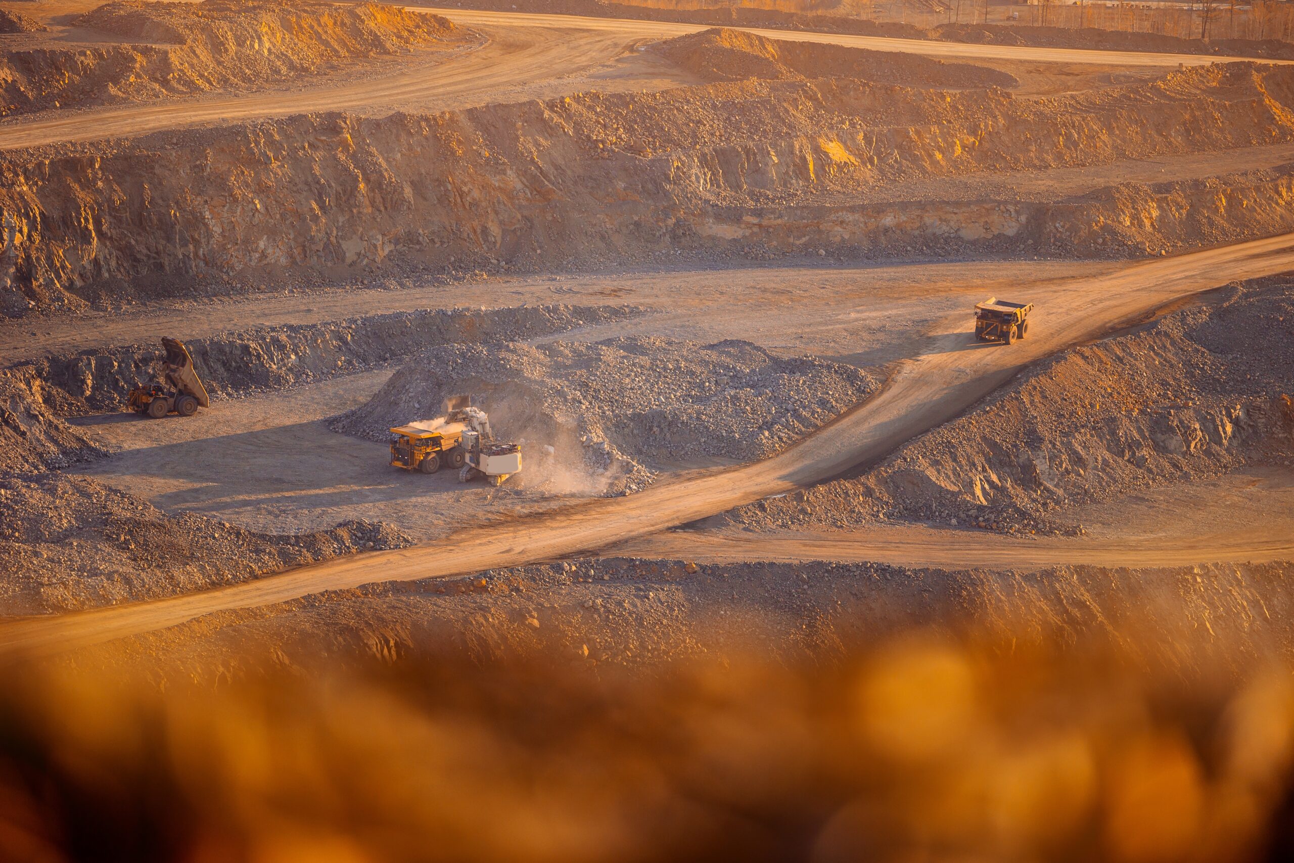 Aerial,View,Of,Open-pit,Mining,Operation,With,Haul,Trucks,In